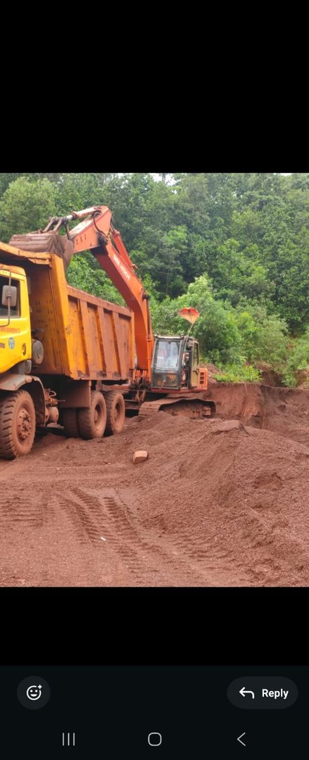 Excavator loading dumper